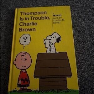 Thompson is in trouble Charlie Brown by Charles m Schultz.